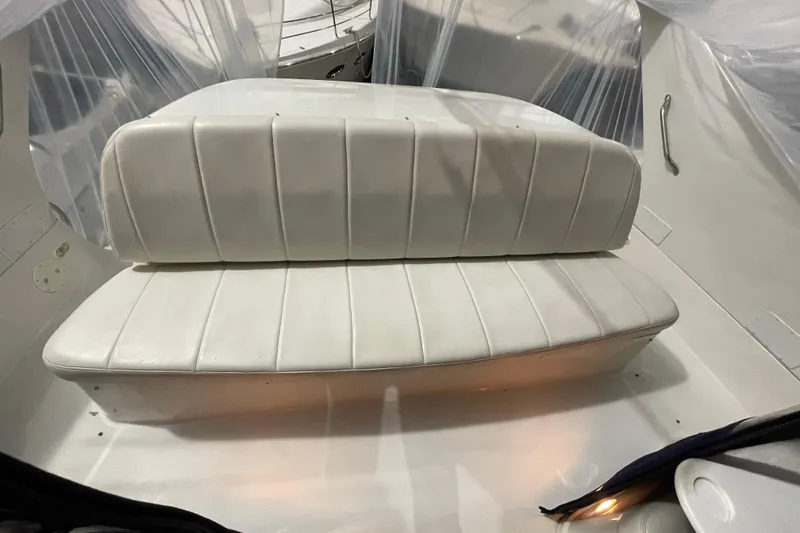 Slide: The Image of 2007 Carver 360 Mariner boat interior with white cushioned seating. - 30
