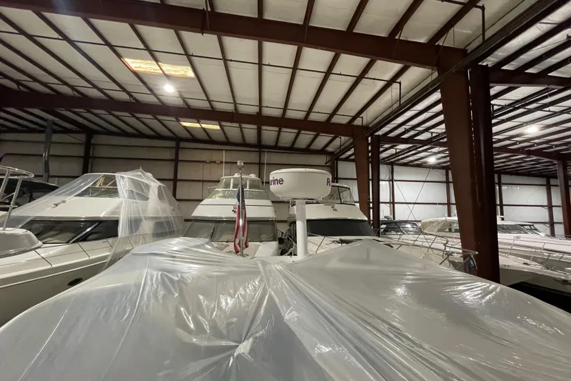 Slide: The Image of 2007 Carver 360 Mariner yacht stored indoors, covered with protective plastic sheeting. - 31