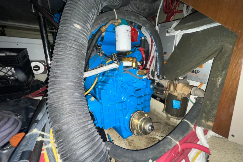 Slide: The Image of Engine compartment of a 2007 Carver 360 Mariner, showcasing mechanical components and wiring. - 37