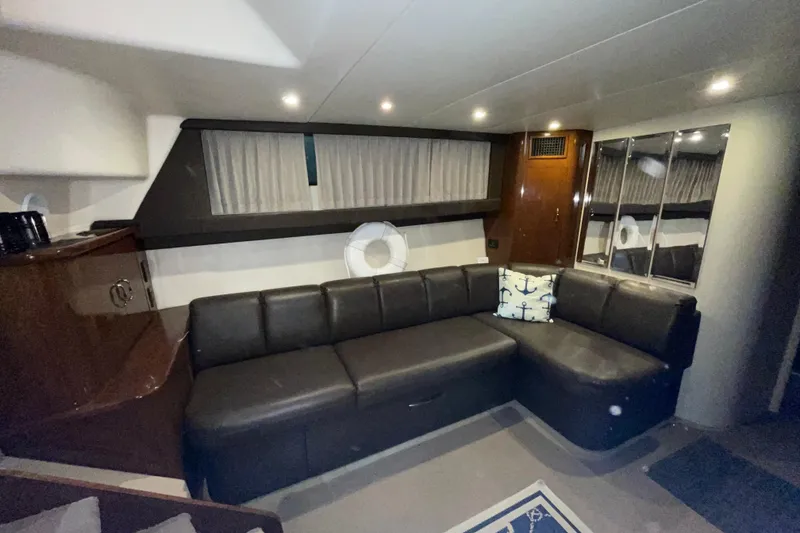 Slide: The Image of Luxurious interior of 2007 Carver 360 Mariner yacht with leather seating and nautical decor. - 4