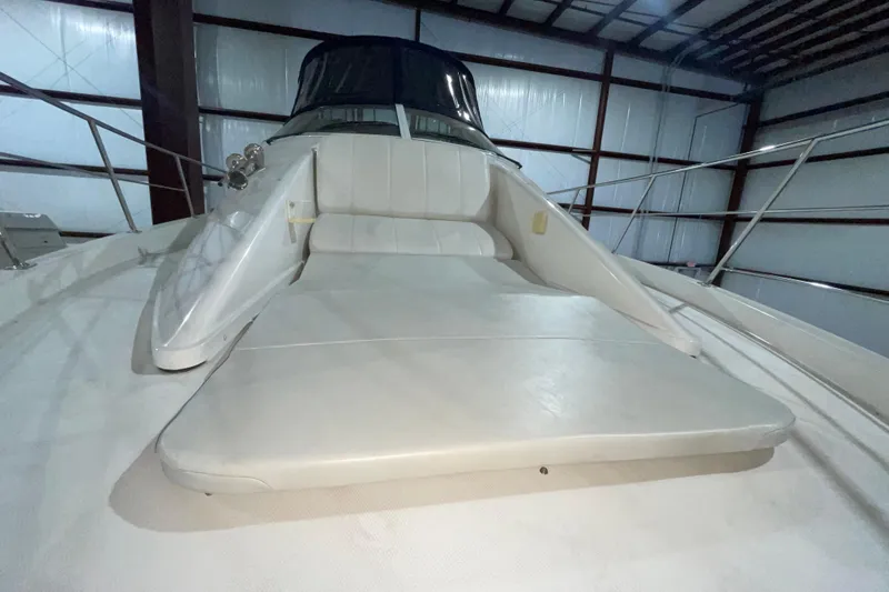 Slide: The Image of 2007 Carver 360 Mariner yacht interior with cushioned seating in a spacious cabin. - 45