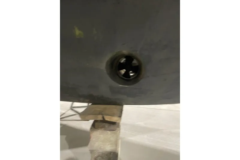 Slide: The Image of Close-up of a 2007 Carver 360 Mariner's hull with a visible thruster. - 49