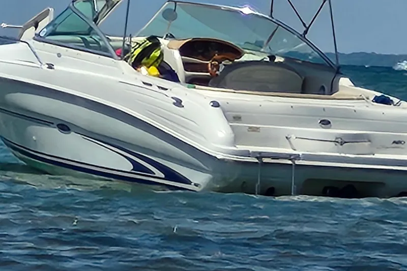 Slide: The Image of 2001 Sea Ray 260 Overnighter boat cruising on open water. - 2