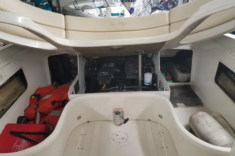 Slide: The Image of 2001 Sea Ray 260 Overnighter boat interior with engine and storage compartments. - 3