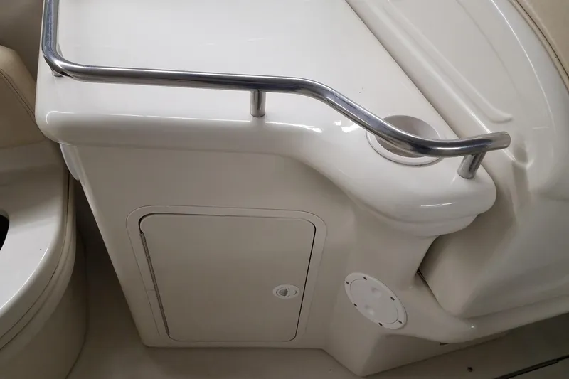 Slide: The Image of Interior view of a 2001 Sea Ray 260 Overnighter boat with storage compartment. - 6