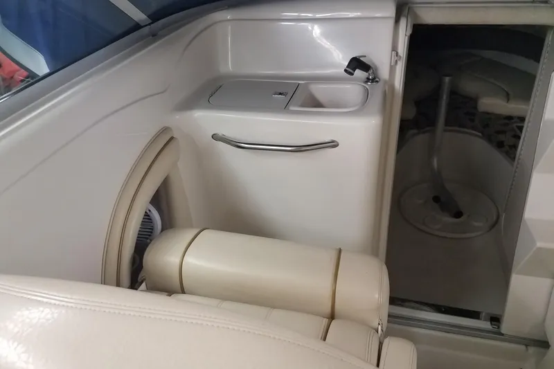Slide: The Image of 2001 Sea Ray 260 Overnighter interior with sink and cabin entrance. - 7