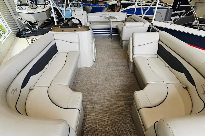 Slide: The Image of 2019 Bennington 21 SX Swingback pontoon boat interior with plush seating and modern design. - 13