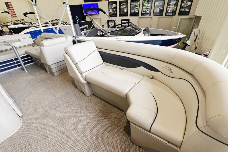 Slide: The Image of 2019 Bennington 21 SX Swingback pontoon boat interior with luxurious seating and modern design. - 14