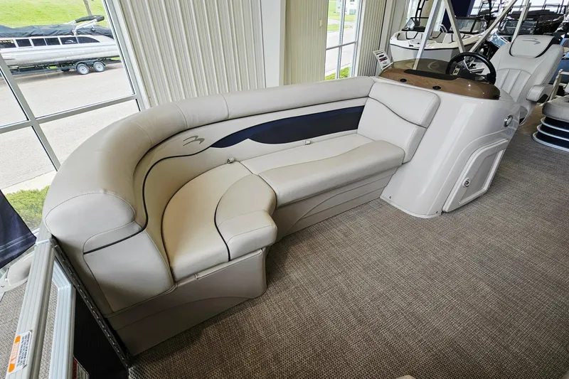 Slide: The Image of 2019 Bennington 21 SX Swingback boat interior with plush seating and steering console. - 15