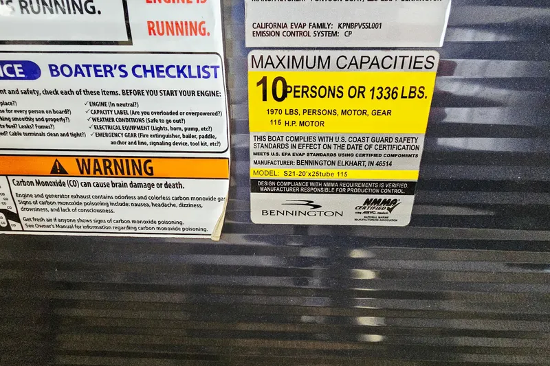 Slide: The Image of Safety and capacity labels on a 2019 Bennington 21 SX Swingback boat. - 17