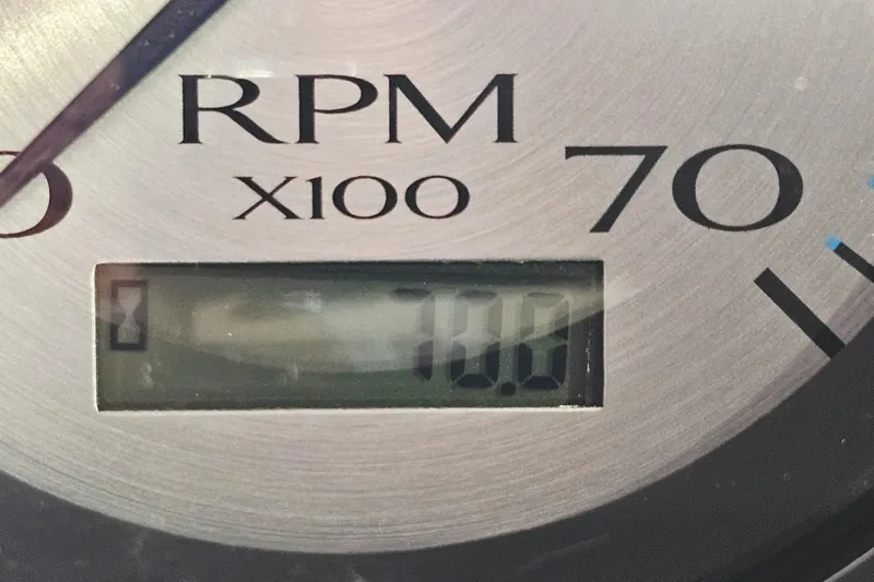 Slide: The Image of Close-up of a 2019 Bennington 21 SX SWINGBACK RPM gauge displaying 700 RPM. - 18