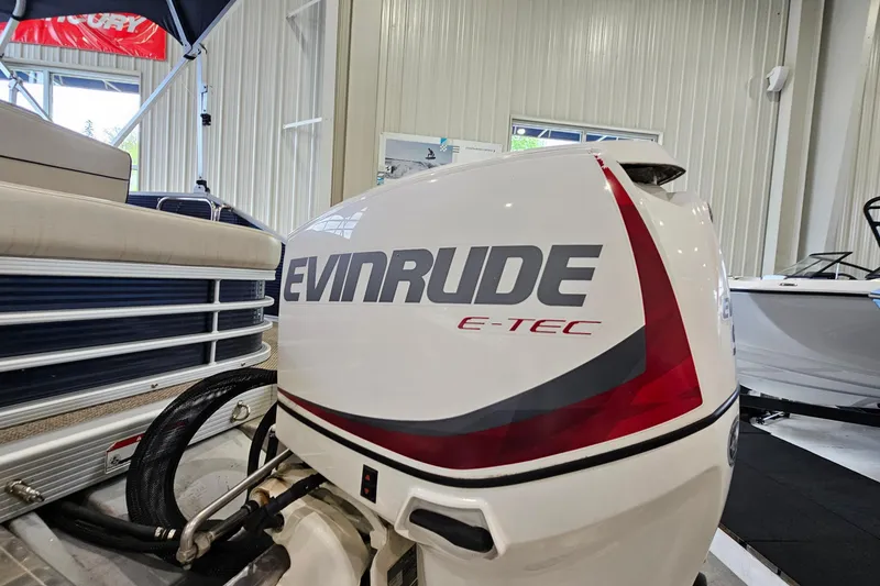Slide: The Image of 2019 Bennington 21 SX Swingback with Evinrude E-TEC outboard motor in showroom. - 19