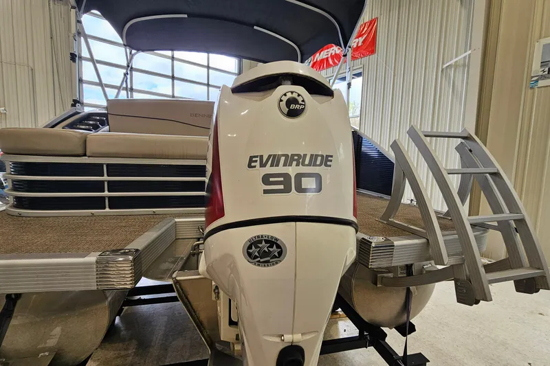 Slide: The Image of 2019 Bennington 21 SX Swingback pontoon boat with Evinrude 90 engine in showroom. - 20