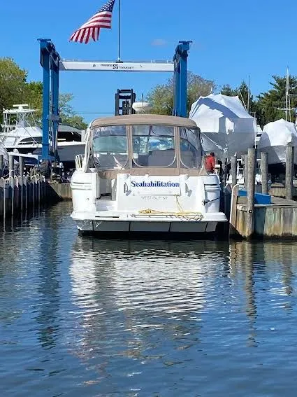 Slide: The Image of 2001 Cruisers Yachts 3870 docked with American flag. - 2
