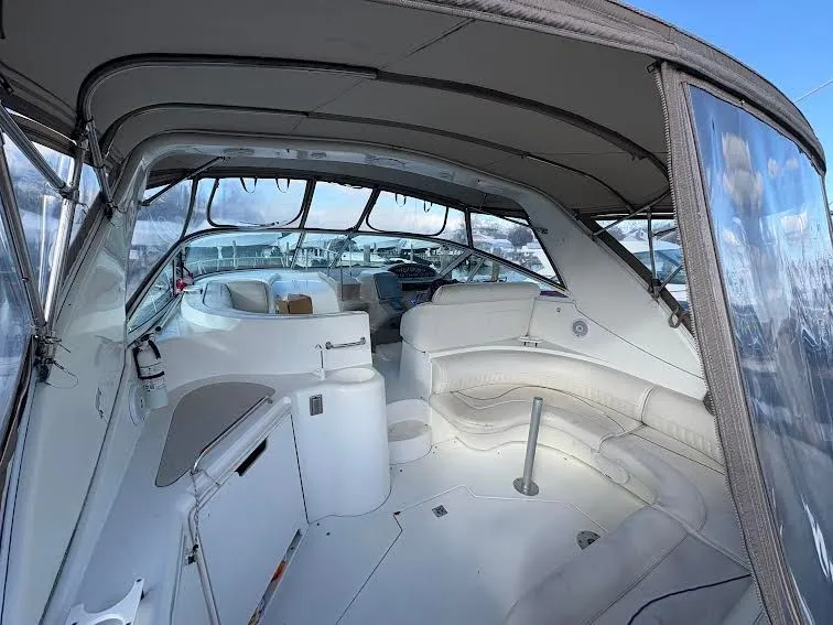Slide: The Image of Interior of a 2001 Cruisers Yachts 3870 with seating area and helm. - 5