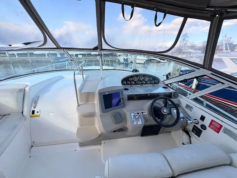 Slide: The Image of Helm of a 2001 Cruisers Yachts 3870 with modern equipment. - 6