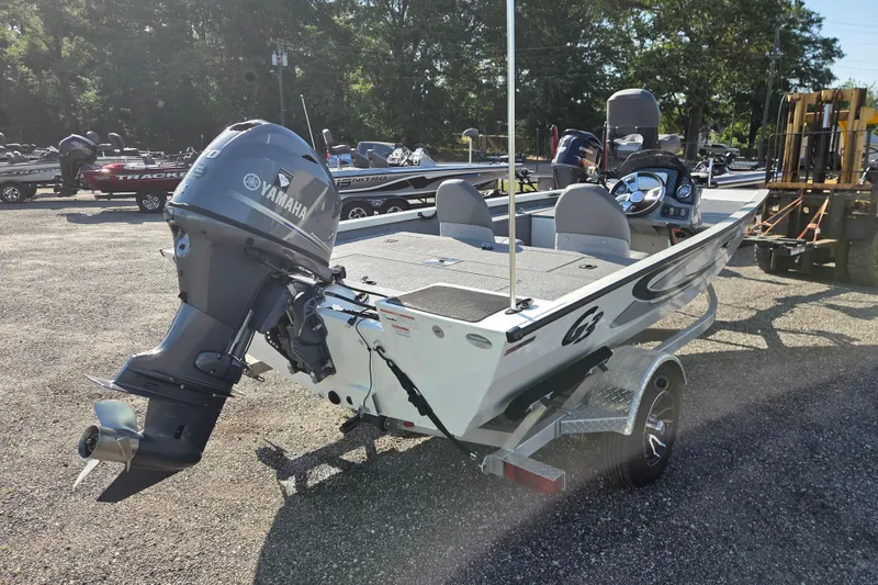 Slide: The Image of 2022 G3 Sportsman 1610 boat with Yamaha outboard motor, parked outdoors. - 4