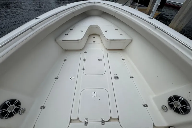 Slide: The Image of 2006 Pursuit 3480 Center Console boat deck with storage compartments and seating. - 11