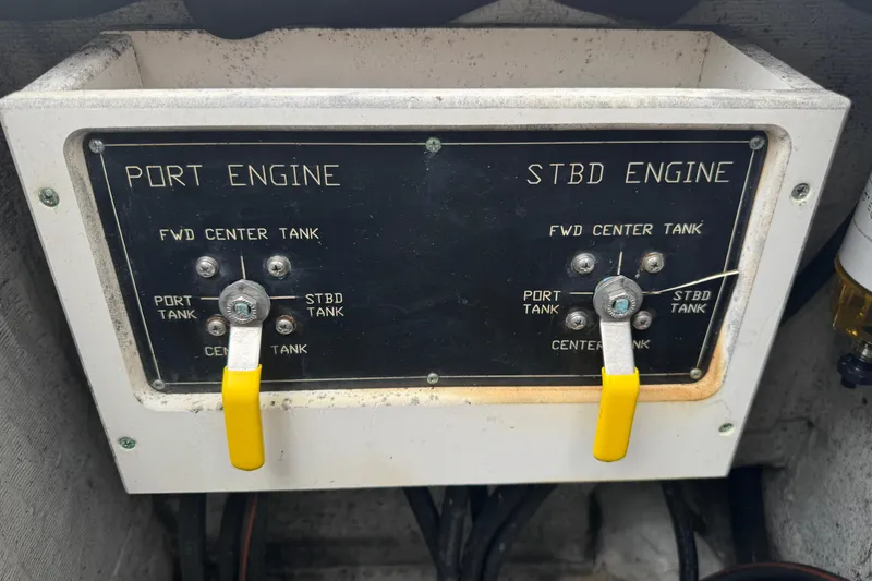 Slide: The Image of Control panel of a 2006 Pursuit 3480 Center Console boat engine system. - 19