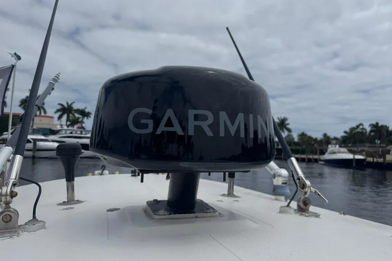 Slide: The Image of Garmin radar on 2006 Pursuit 3480 Center Console boat, docked near palm trees. - 21