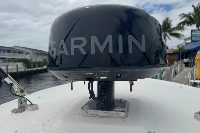 Slide: The Image of Garmin radar on 2006 Pursuit 3480 Center Console boat, docked near waterfront homes. - 23