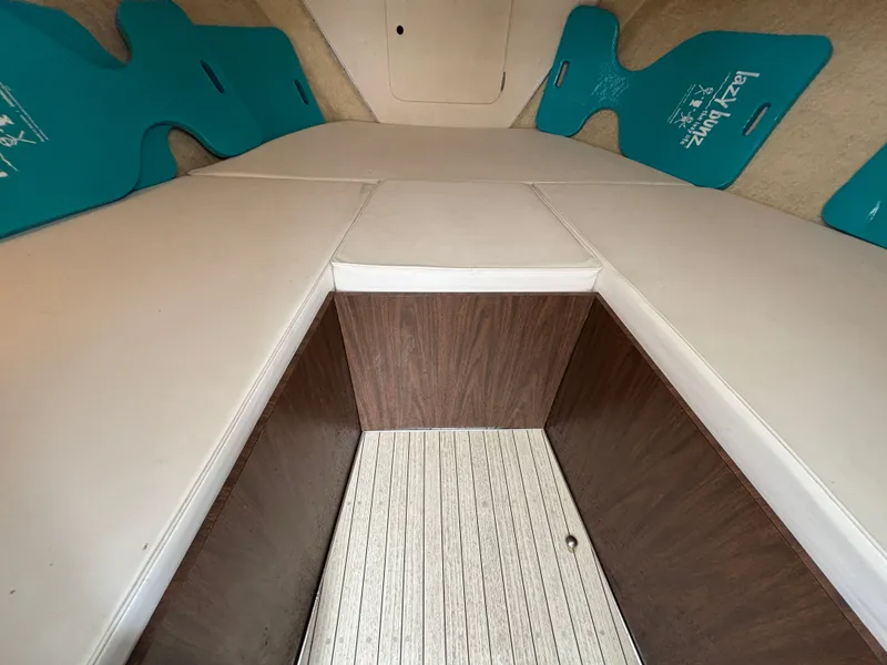 Slide: The Image of Interior of a 1978 Bertram MOPPIE boat with white upholstery. - 15
