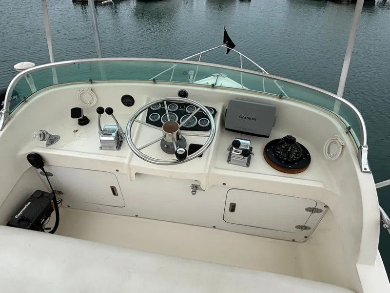Slide: The Image of Cockpit of a 1978 Bertram MOPPIE boat with Garmin navigation. - 17