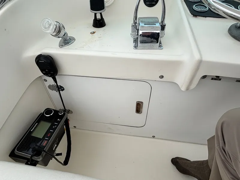 Slide: The Image of Interior of a 1978 Bertram MOPPIE boat with controls and radio. - 18