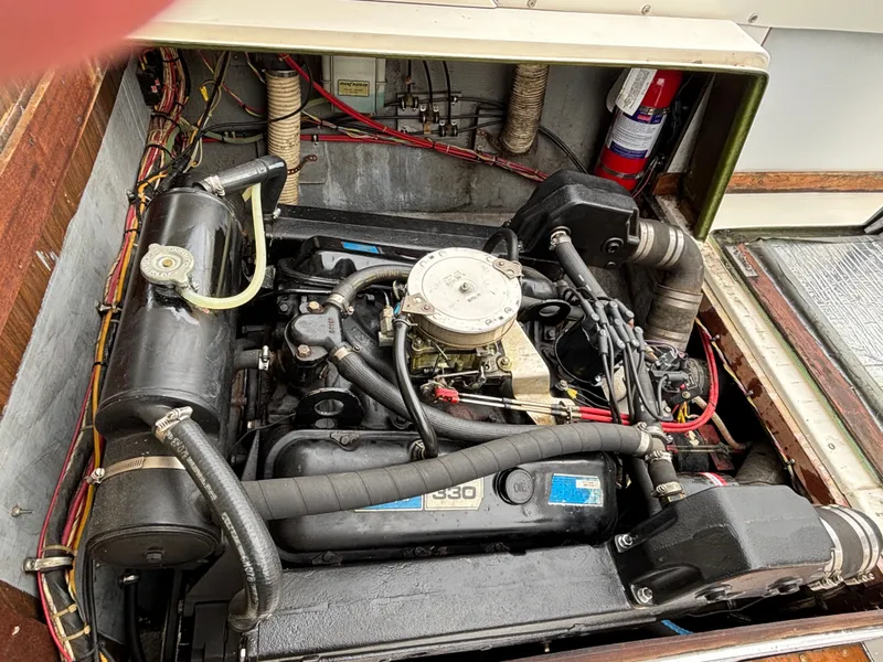 Slide: The Image of Engine compartment of a 1978 Bertram MOPPIE boat with visible engine. - 27