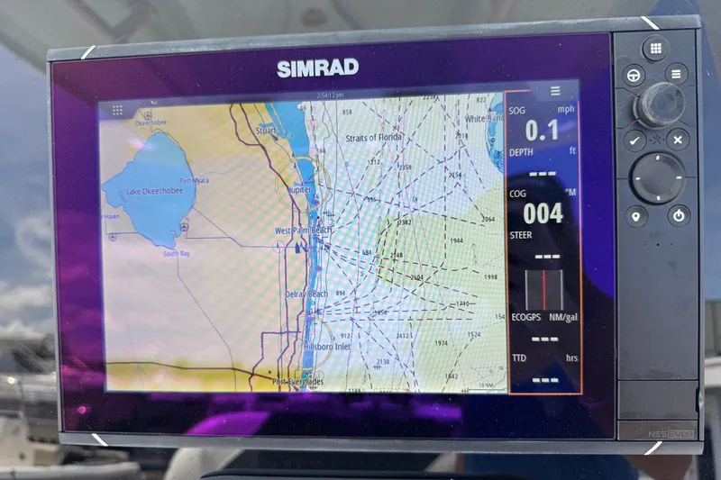 Slide: The Image of Simrad navigation display on 2014 Tidewater 250 CC Adventure boat, showing Florida coastline map. - 11