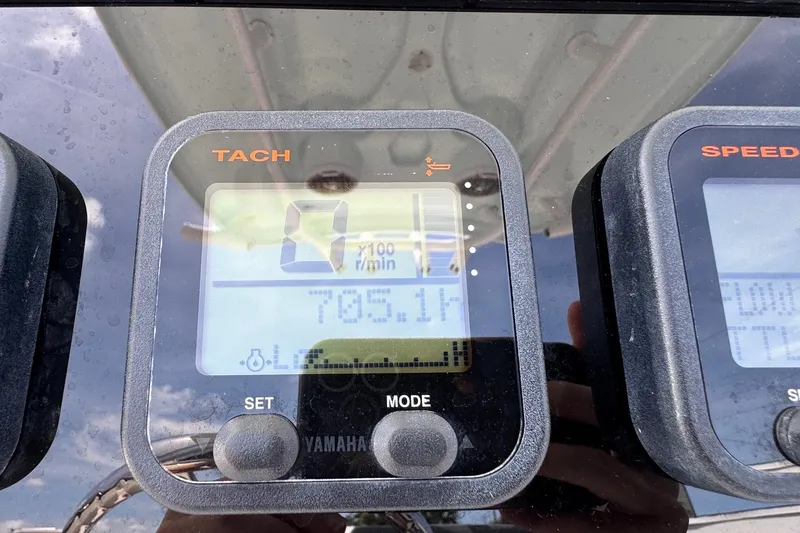 Slide: The Image of Tachometer display on 2014 Tidewater 250 CC Adventure boat dashboard. - 15