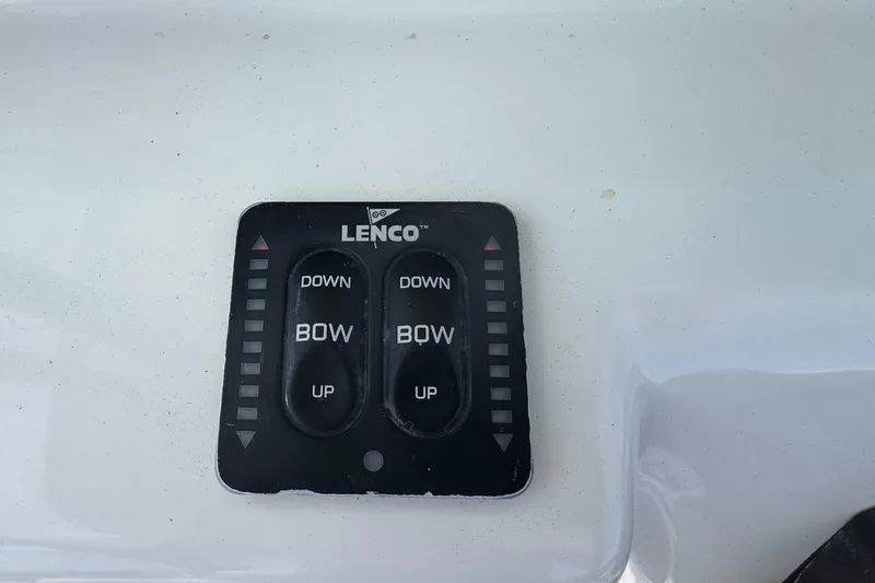 Slide: The Image of Lenco trim tab control panel on 2014 Tidewater 250 CC Adventure boat. - 17