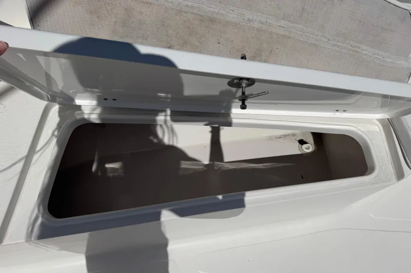 Slide: The Image of Open storage compartment on 2014 Tidewater 250 CC Adventure boat. - 31