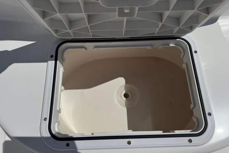 Slide: The Image of Open storage compartment on a 2014 Tidewater 250 CC Adventure boat. - 33