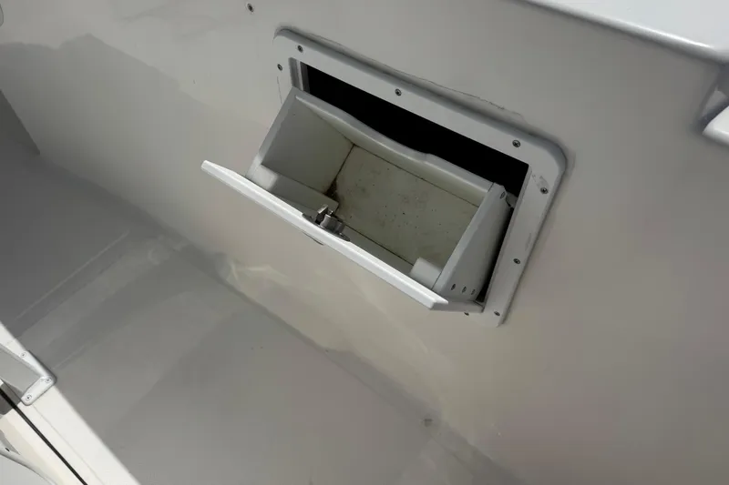 Slide: The Image of Open storage compartment on a 2014 Tidewater 250 CC Adventure boat. - 35