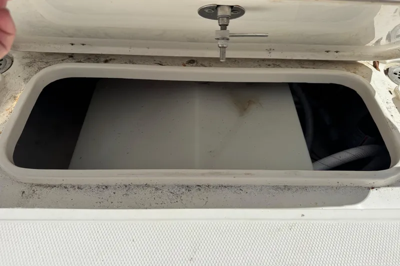 Slide: The Image of Open storage compartment on a 2014 Tidewater 250 CC Adventure boat. - 40
