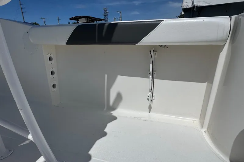 Slide: The Image of 2014 Tidewater 250 CC Adventure boat interior with white and black seating. - 42