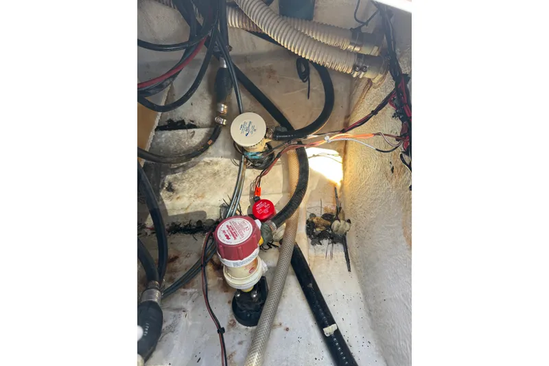 Slide: The Image of Interior wiring and components of a 2014 Tidewater 250 CC Adventure boat. - 46