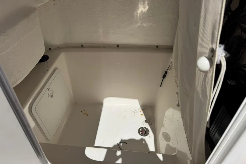 Slide: The Image of Interior compartment of a 2014 Tidewater 250 CC Adventure boat, featuring a storage area. - 49
