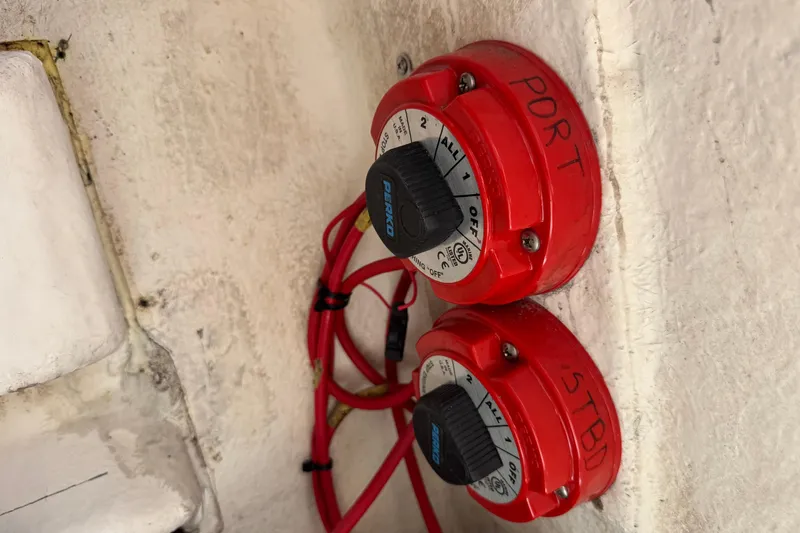Slide: The Image of Red battery switches labeled "PORT" and "STBD" on a 2014 Tidewater 250 CC Adventure boat. - 51