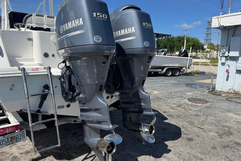 Slide: The Image of Twin Yamaha 150 outboard engines on a 2014 Tidewater 250 CC Adventure boat. - 52