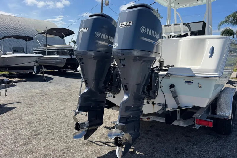 Slide: The Image of 2014 Tidewater 250 CC Adventure boat with dual Yamaha 150 engines on a trailer. - 53