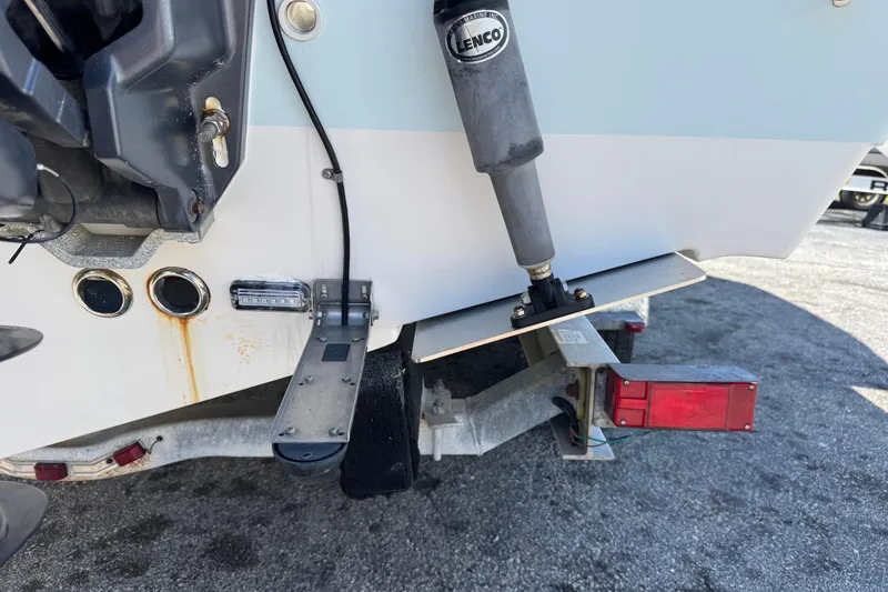 Slide: The Image of 2014 Tidewater 250 CC Adventure boat with Lenco trim tab and trailer. - 55