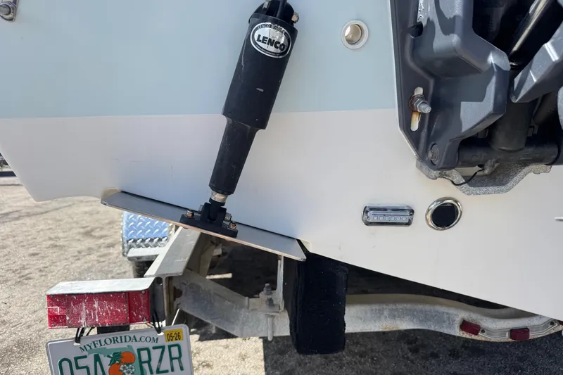 Slide: The Image of 2014 Tidewater 250 CC Adventure boat with Lenco trim tab and Florida license plate. - 56