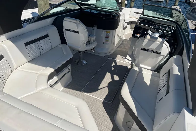 Slide: The Image of Interior of a 2018 Sea Ray SLX 250 boat with luxurious white seating. - 15
