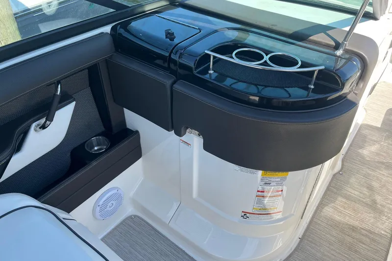 Slide: The Image of Interior of 2018 Sea Ray SLX 250 boat with cup holders and speaker. - 17