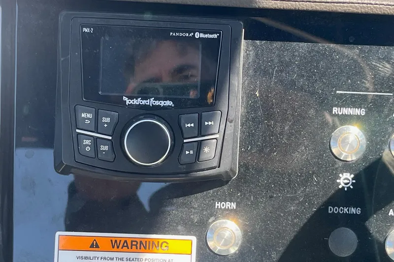 Slide: The Image of Control panel of a 2018 Sea Ray SLX 250 with Rockford Fosgate audio system. - 27