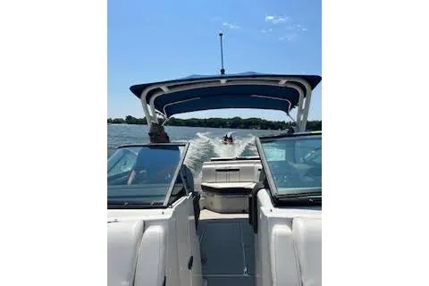 Slide: The Image of 2018 Sea Ray SLX 250 boat cruising on a sunny lake. - 3