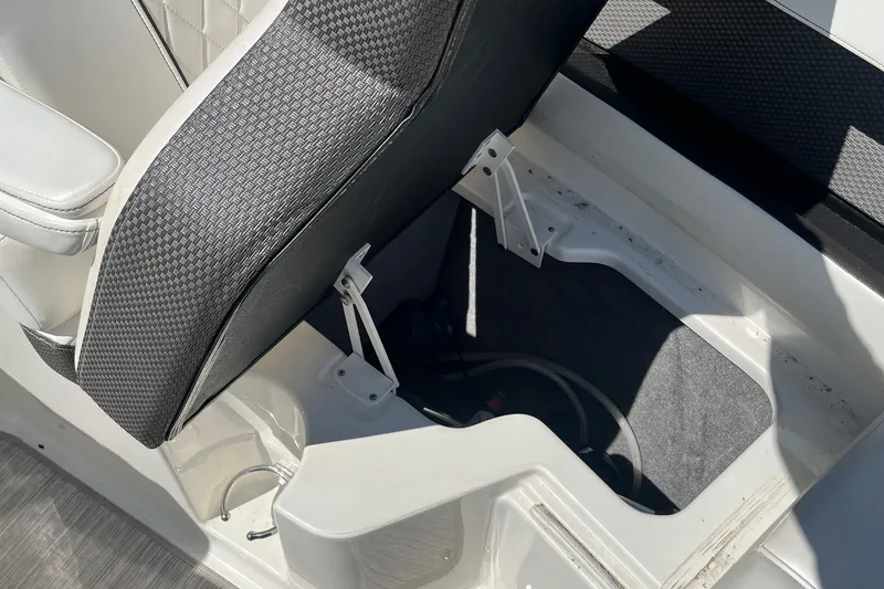 Slide: The Image of 2018 Sea Ray SLX 250 boat seat with open storage compartment. - 33