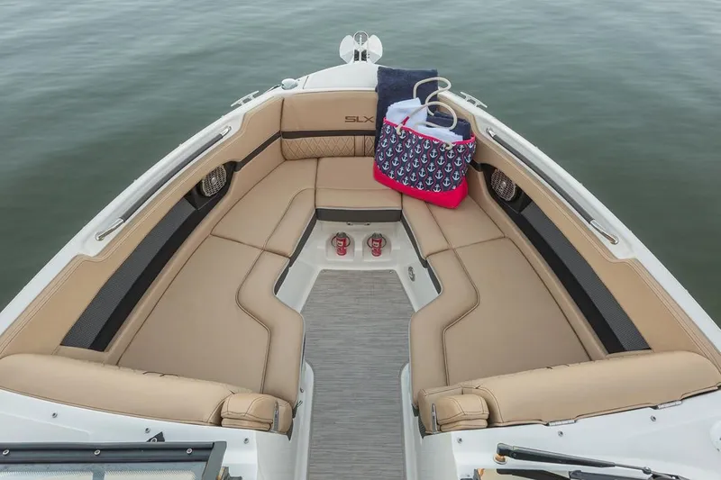 Slide: The Image of Manufacturer Provided Image: 2018 Sea Ray SLX 250 boat with spacious tan seating and accessories. - 4